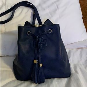 Tory Burch drawstring bucket bags.